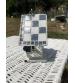 Birdhouse done in mosaic checkerboard white and gray with decorations