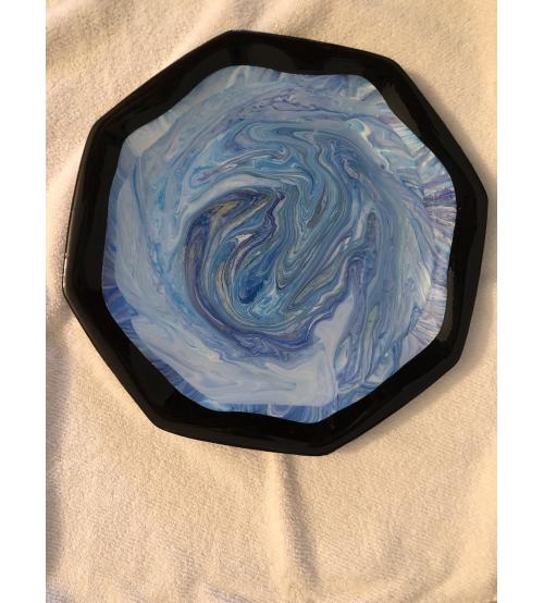 Black dinner plate done in acrylic paint with epoxy